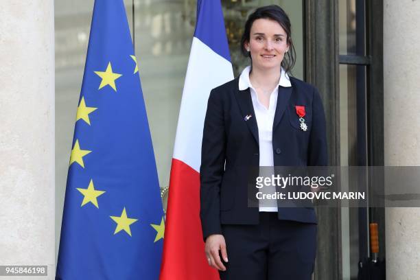 French alpine skier and Paralympic Champion Marie Bochet poses outside the Elysee Palace in Paris on April 13 after being awarded Officier of the...