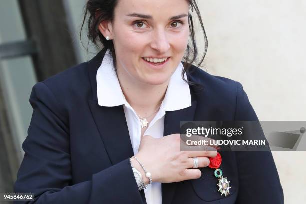 French alpine skier and Paralympic Champion Marie Bochet poses outside the Elysee Palace in Paris on April 13 after being awarded Officier of the...