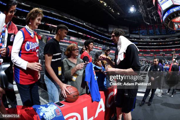 Boban Marjanovic of the LA Clippers signs autograph for fans before the game against the Los Angeles Lakers on April 11, 2018 at STAPLES Center in...