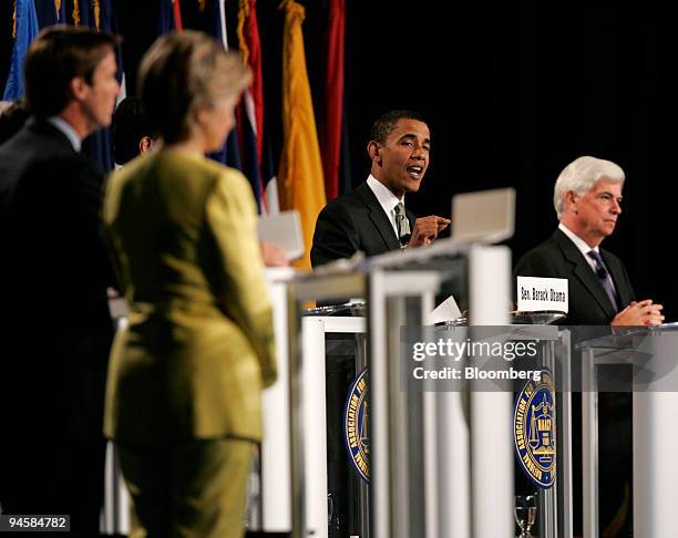 Barack Obama, Democratic Presidential candidate and Illinois Senator, center, speaks at the NAACP annual convention at the Cobo Center in Detroit,...