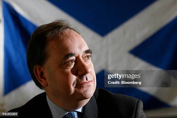 Alex Salmon, Leader of the Scottish National Party poses with the Saltire flag, the national flag of Scotland in the background at their headquarters...