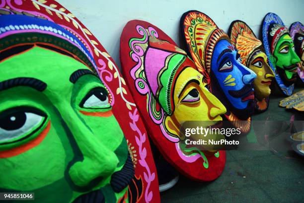 Student of Faculty of Fine arts of Dhaka University painting masks for colorful preparation to celebrate upcoming Bengali New Year 1425 in Dhaka,...