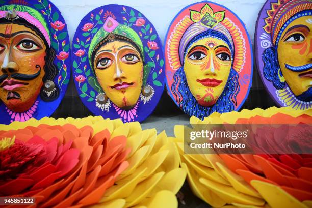 Student of Faculty of Fine arts of Dhaka University painting masks for colorful preparation to celebrate upcoming Bengali New Year 1425 in Dhaka,...