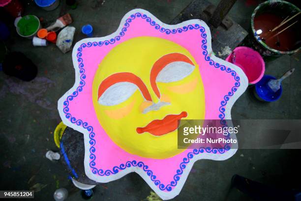 Student of Faculty of Fine arts of Dhaka University painting masks for colorful preparation to celebrate upcoming Bengali New Year 1425 in Dhaka,...
