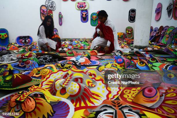 Student of Faculty of Fine arts of Dhaka University painting masks for colorful preparation to celebrate upcoming Bengali New Year 1425 in Dhaka,...