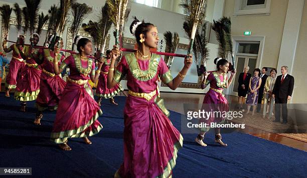 American President George W. Bush and First Lady Laura Bush watch a Indian dance performance by school kids during their visit to the Asian...