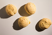 Pao de Queijo is a cheese bread ball from Brazil. Also known as Chipa, Pandebono and Pan de Yuca. Snacks over white background, minimalism.