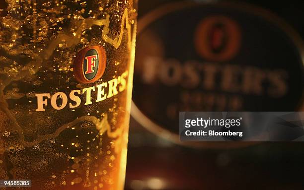 Pint of Fosters lager is arranged on a bar at the Queen's Head public hoiuse in Littlebury, Essex, on Wednesday, Oct. 17, 2007. Heineken NV, the...