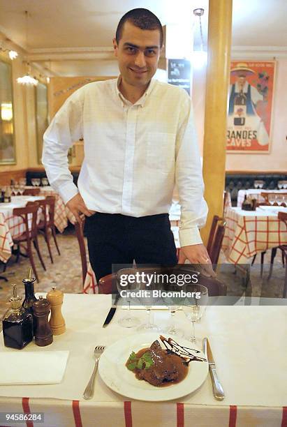 Lionel Chauvin, owner of Mathusalem restaurant, presents a liver veal dish in Paris, France, Monday, November 13, 2006. The best little bistro in...