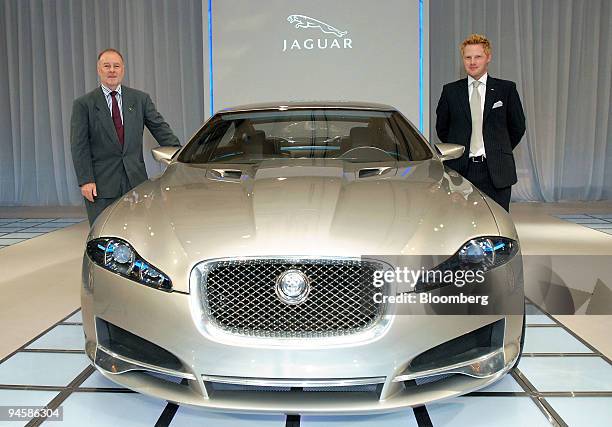 David Blume, president of Jaguar Cars Ltd.'s Japanese unit, left, and Adam Hatton, Jaguar designer, pose next to the company's new C-XF concept...