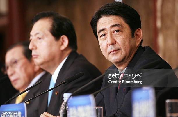 Shinzo Abe, prime minister of Japan, right, speaks during a debate for the upcoming elections for the upper house of parliament while Akihiro Ohta,...