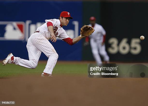 National League's Chase Utley, of the Philadelphia Phillies, chases after a ground ball during Major League Baseball's All-Star game in San...