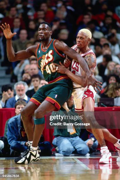 Shawn Kemp of the Seattle SuperSonics posts up Dennis Rodman of the Chicago Bulls during the game on January 10, 1996 at the United Center in...