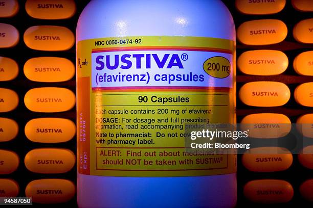 Tablets of HIV treatment Sustiva flank a bottle for the medicine's capsules in an illustration at Skenderian Apothecary in Cambridge, Massachusetts...