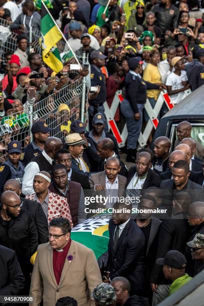 The body of Winnie Mandela is returned to her home in Soweto the day before the funeral for the anti-apartheid icon on April 13, 2018 in Soweto,...