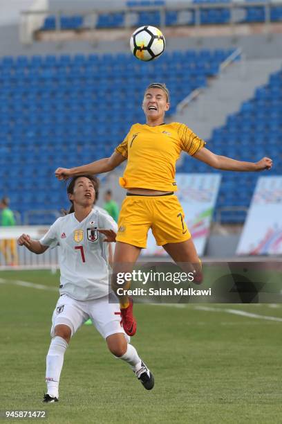 Stephanie Catley of Australia jumps for the ball in front of Emi Nakajima of Japan during the AFC Women's Asian Cup Group B match between Japan and...