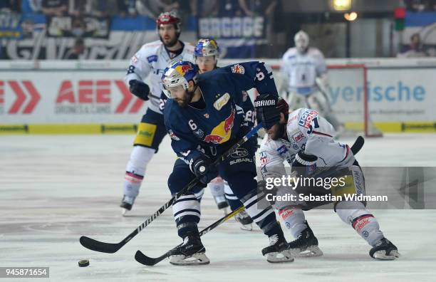 Daryl Boyle of EHC Muenchen and Sean Backman of Berlin compete for the puck during the DEL Playoff Final Game 1 between EHC Red Bull Muenchen and...