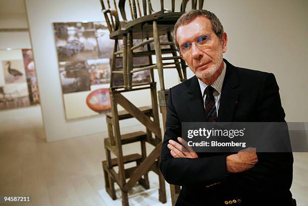Arne Glimcher, chairman of the PaceWildenstein Gallery, poses among the artwork of Robert Rauschenberg at the gallery in New York, Tuesday, November...