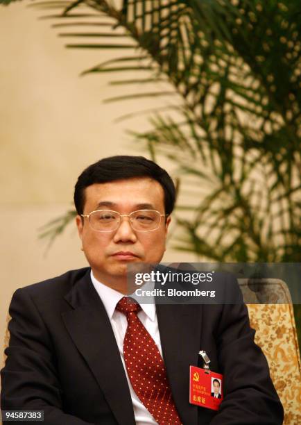 Li Keqiang, 52-year-old Party secretary of the northeastern province of Liaoning attends a meeting in the Great Hall of the People in Beijing, China,...