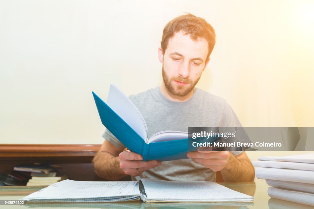 Young man taking notes