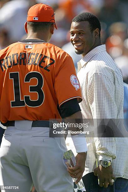 Alex Rodriguez, left, of the American League's New York Yankees, chats with Ken Griffey Jr., of the National League's Cincinnati Reds, during the...