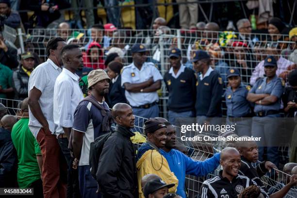 People line the streets as the body of Winnie Mandela is returned to her home in Soweto the day before the funeral for the anti-apartheid icon on...