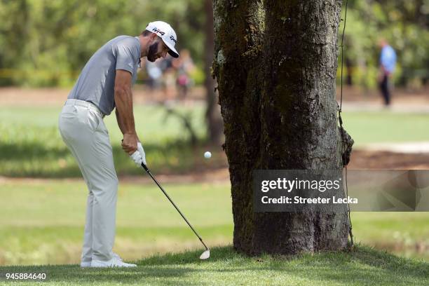 Dustin Johnson plays his second shot left-handed on the seventh hole during the second round of the 2018 RBC Heritage at Harbour Town Golf Links on...