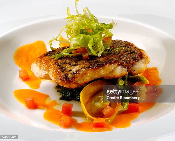 Roasted Pacific red snapper is served at the BLU restaurant, located on the 24th floor of the Shangri-La Hotel in Singapore, Tuesday, September 12,...