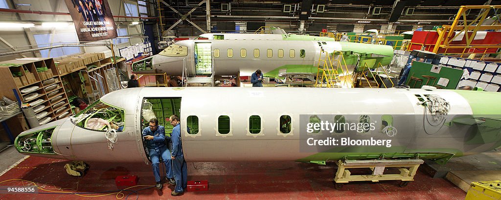 Bombardier aircraft electricians work on a Learjet 40 XR air