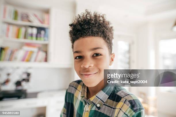 smiling at the camera. - boys stock pictures, royalty-free photos & images