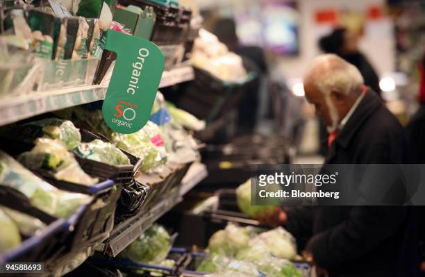 Man browses the organic vegetable section at a Sainsbury's store in east London, U.K., on Monday, November 13, 2006. Britain's organic food industry...