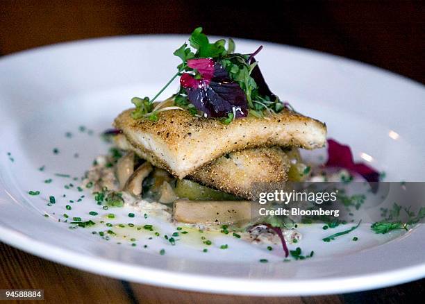 Plate of "La Sogliola," polenta dusted lemon sole, is served at Aurora SoHo, a restaurant located at 510 Broome Street in New York, Saturday, June...
