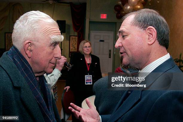 Former Virginia Governor Jim Gilmore, right, speaks with Amos Townsend of Lee, New Hampshire, following a luncheon at the Taste of Europe restaurant...