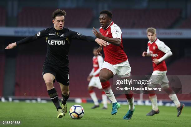 Tolaji Bola of Arsenal and Jack Evans of Swansea City battle for possession during the Premier League 2 match between Arsenal and Swansea City at...