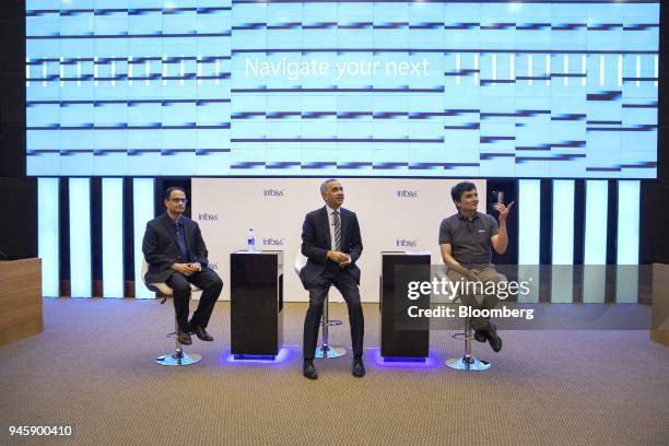 Salil Parekh, chief executive officer of Infosys Ltd., center, speaks as Pravin Rao, chief operating officer of Infosys Ltd., left, and Ranganath D....