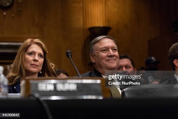 Michael Pompeo , director of the Central Intelligence Agency and U.S. Secretary of state nominee for the Trump administration, with his wife Susan ,...