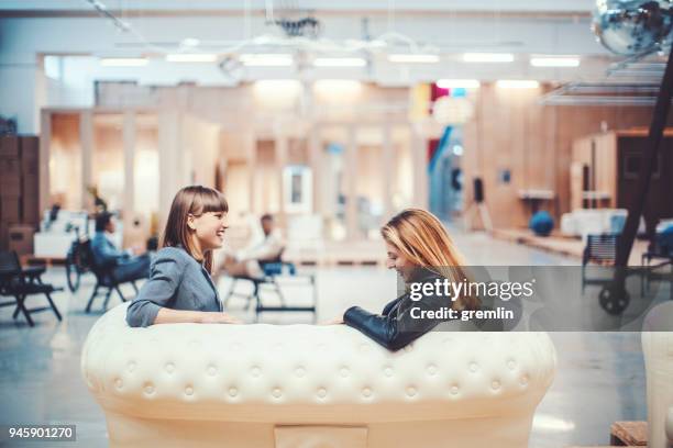 colleagues resting in creative office space - comfortable couch stock pictures, royalty-free photos & images