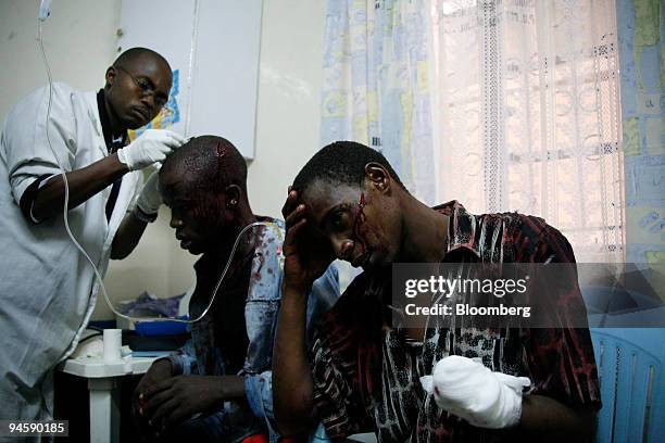 Doctor attends to victims of violence in the Huruma area of Nairobi, Kenya on Sunday, Jan. 20, 2008. Renewed ethnic fighting between members of the...