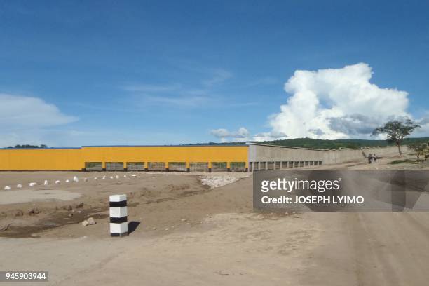 Photo taken on April 11 shows the part of newly built 24-kilometre-wall around the country's tanzanite mines to prevent smuggling of the precious...