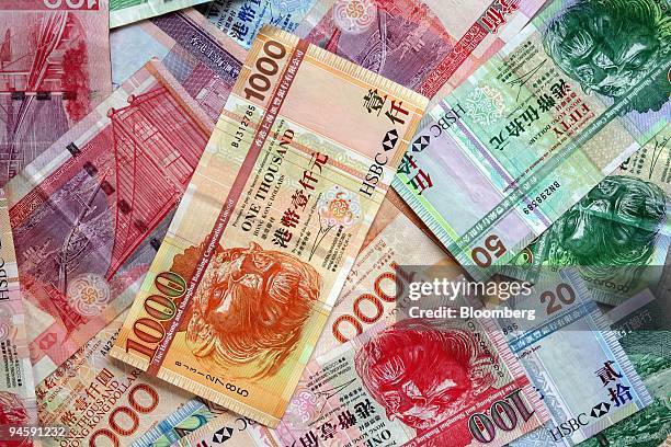 Hong Kong dollars of various denominations are displayed on Thursday, May 17 in Hong Kong, China. The Hong Kong dollar may fall to the lowest since...
