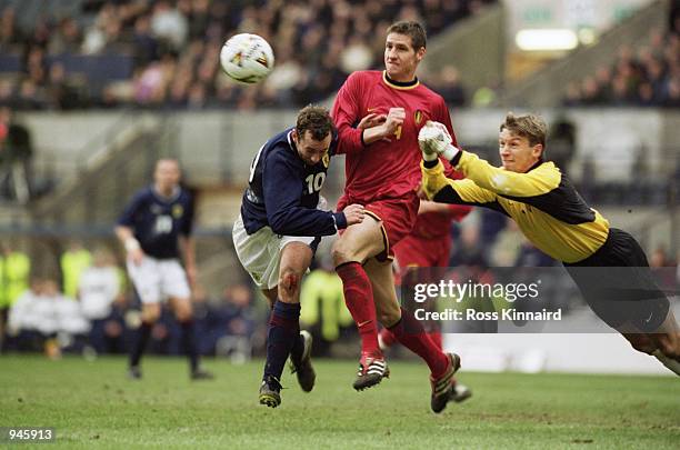 Geert De Vlieger of Belgium clears the ball from Don Hutchison of Scotland during the World Cup 2002 Group Six Qualifying match played at Hampden...