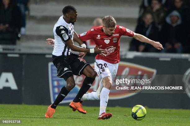 Angers' Cameroonian forward Karl Toko Ekambi vies with Nice's French defender Maxime Le Marchand during the French L1 Football match between Angers...