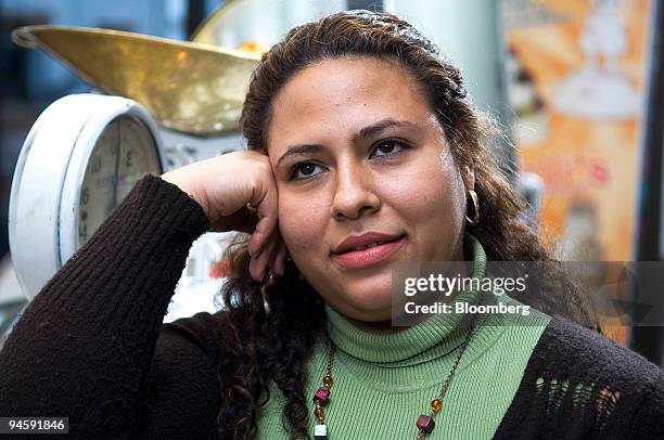 Adriana Aguirre poses in a Colombian bakery where she works in Stamford, Connecticut, Thursday, Jan. 25, 2007. Aguirre, who also works as a baby...