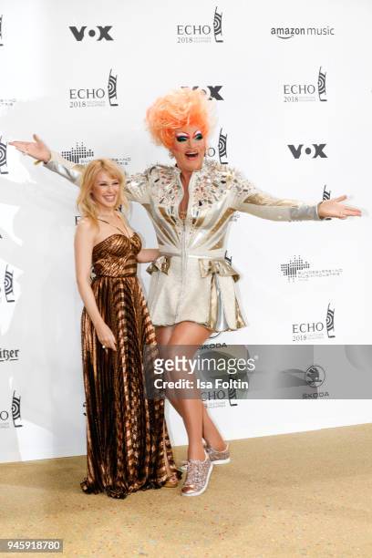 Australian singer Kylie Minogue and Drag Queen Olivia Jones arrive for the Echo Award at Messe Berlin on April 12, 2018 in Berlin, Germany.