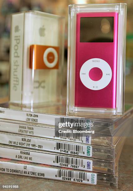 An Apple iPod nano sits on top of several Universal Music CD's at the BYU Bookstore in Provo, Utah, on Monday, July 2, 2007. Universal Music Group...