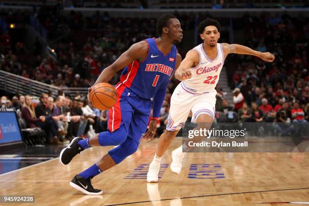 Reggie Jackson of the Detroit Pistons dribbles the ball while being guarded by Cameron Payne of the Chicago Bulls in the first quarter at the United...