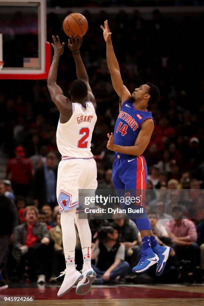 Jerian Grant of the Chicago Bulls attempts a shot Ish Smith of the Detroit Pistons in the first quarter at the United Center on April 11, 2018 in...