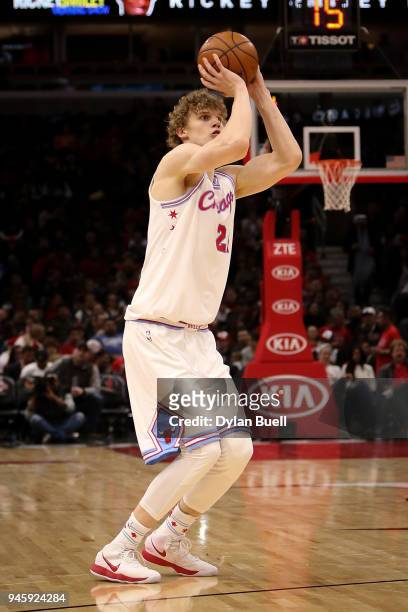 Lauri Markkanen of the Chicago Bulls attempts a shot in the third quarter against the Detroit Pistons at the United Center on April 11, 2018 in...