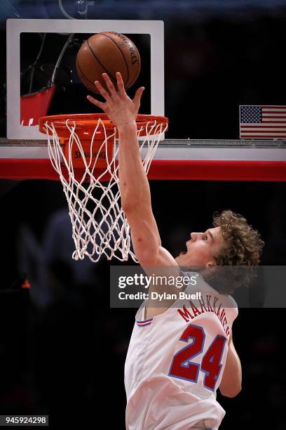 Lauri Markkanen of the Chicago Bulls attempts a shot in the first quarter against the Detroit Pistons at the United Center on April 11, 2018 in...