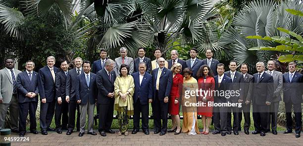 Country representatives attending the Asia-Pacific Economic Cooperation Trade Ministers' meeting pose for a group photograph, in Cairns, Australia,...